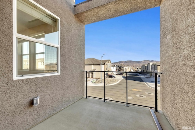 balcony featuring a mountain view