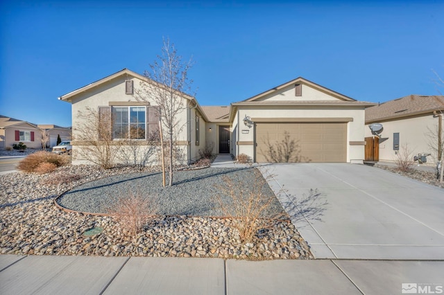 ranch-style home with driveway, an attached garage, and stucco siding