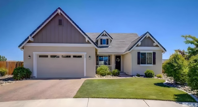 view of front facade featuring a garage and a front lawn