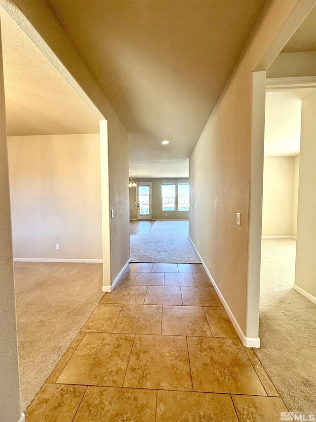 hall featuring carpet floors