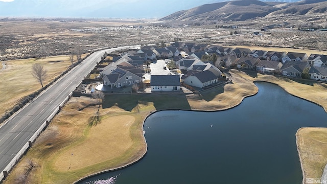 birds eye view of property featuring a water and mountain view