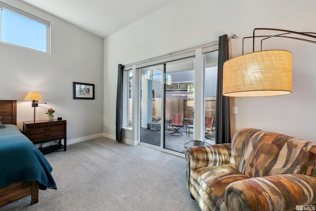 carpeted bedroom featuring access to exterior and lofted ceiling