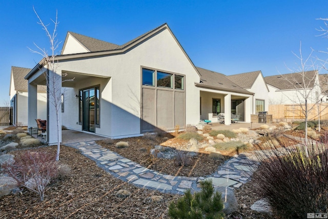 rear view of property with a patio