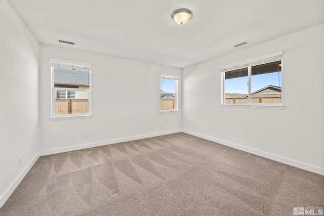 spare room featuring carpet flooring