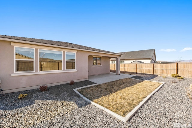 rear view of house with a patio