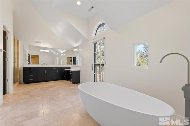 bathroom featuring vanity and separate shower and tub