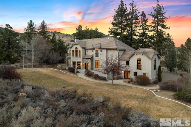 view of front of home featuring a yard