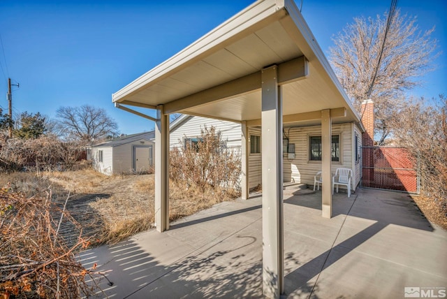 view of patio / terrace featuring a shed