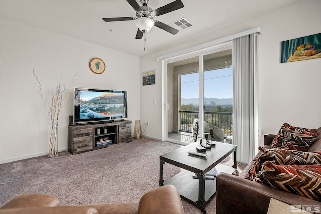 carpeted living room featuring ceiling fan