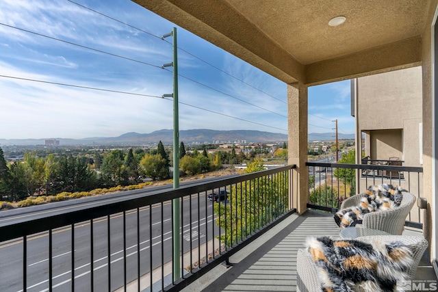 balcony featuring a mountain view