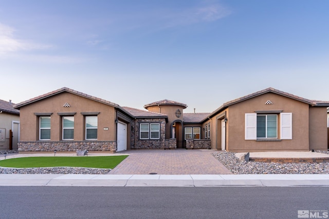 view of front of home with a garage