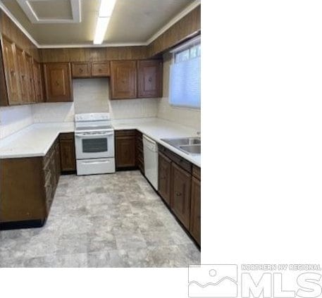 kitchen featuring sink and white appliances