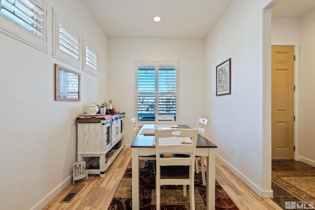 dining space featuring light hardwood / wood-style flooring