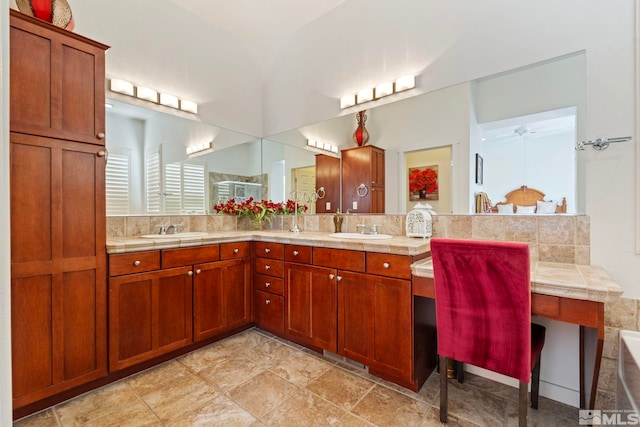 bathroom with vanity, backsplash, and ceiling fan