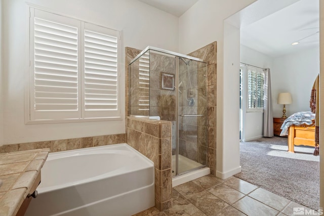 bathroom with tile patterned floors and separate shower and tub