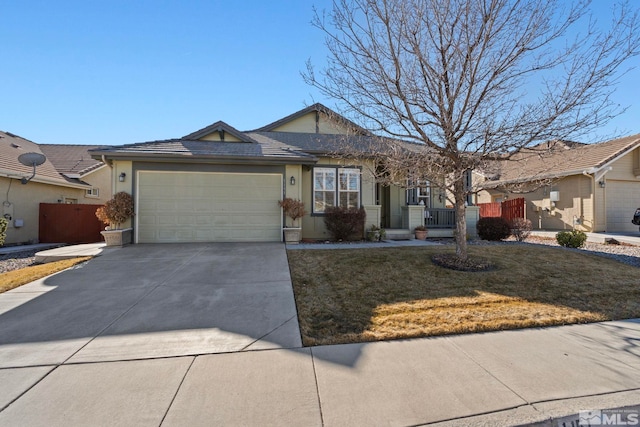 ranch-style home with a garage and a front lawn