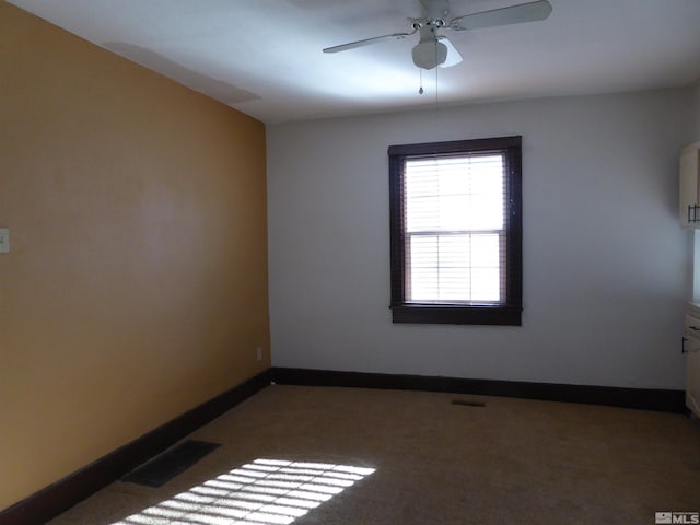 unfurnished room with carpet floors and ceiling fan