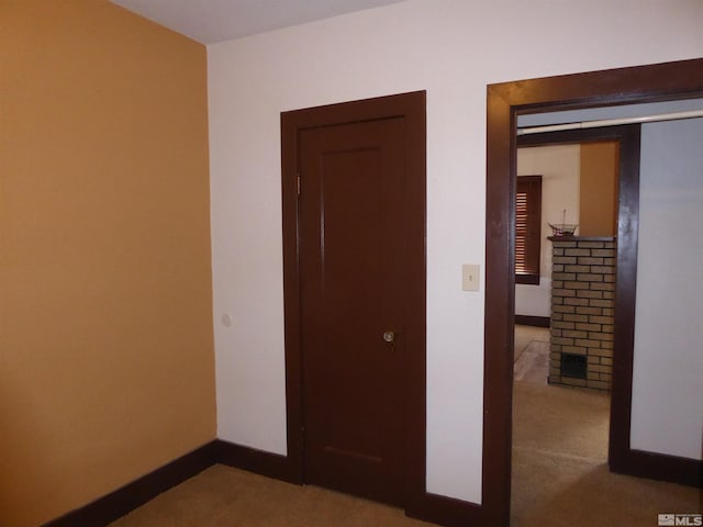 unfurnished bedroom with a closet and carpet floors