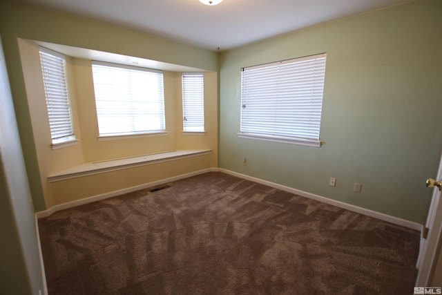 empty room featuring carpet flooring