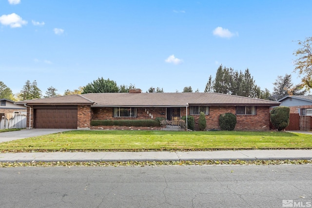 ranch-style home featuring a front yard and a garage