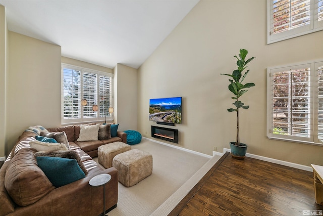 living room with dark hardwood / wood-style floors and lofted ceiling