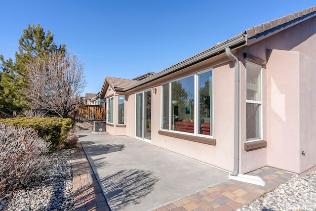 view of side of property featuring a patio area