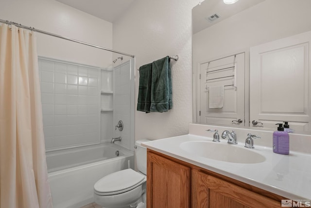 full bathroom featuring vanity, toilet, and shower / tub combo with curtain