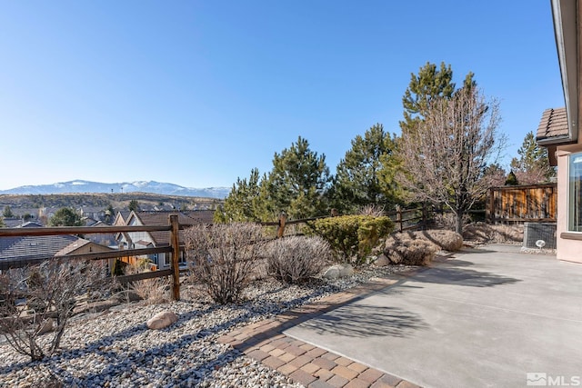 view of yard with a mountain view and a patio