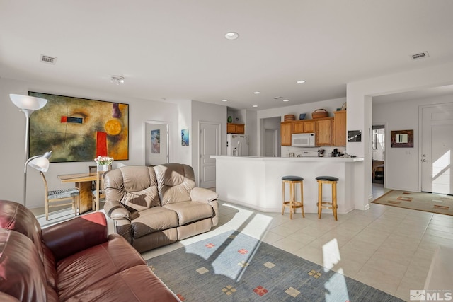 living room with light tile patterned floors