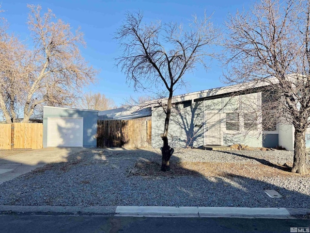 ranch-style home featuring a garage