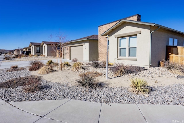 view of side of property with a garage