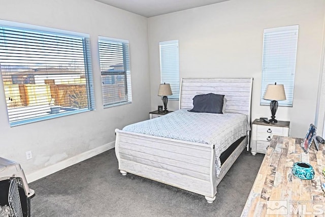 bedroom featuring dark carpet