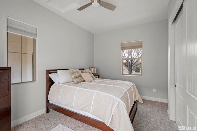 carpeted bedroom with a closet and ceiling fan