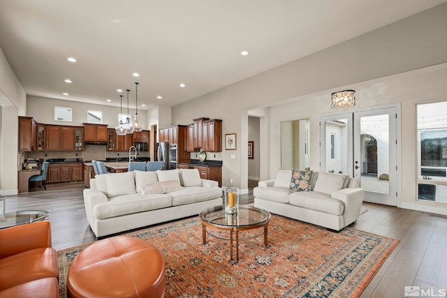 living room featuring sink and dark hardwood / wood-style flooring