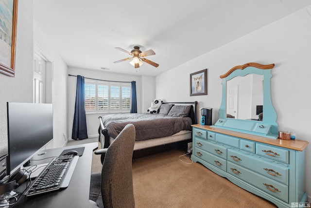 bedroom featuring ceiling fan and light colored carpet