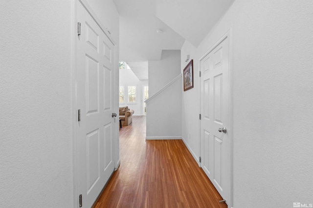 corridor featuring hardwood / wood-style floors