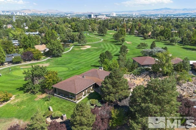 birds eye view of property with a mountain view