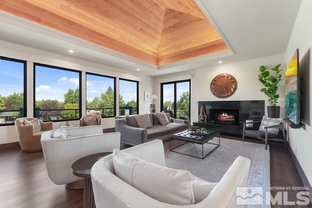 living room with wood ceiling, a tray ceiling, and dark wood-type flooring