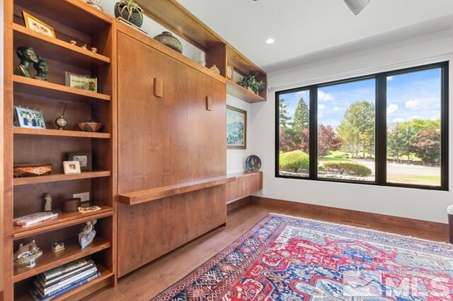 office area with plenty of natural light and hardwood / wood-style floors