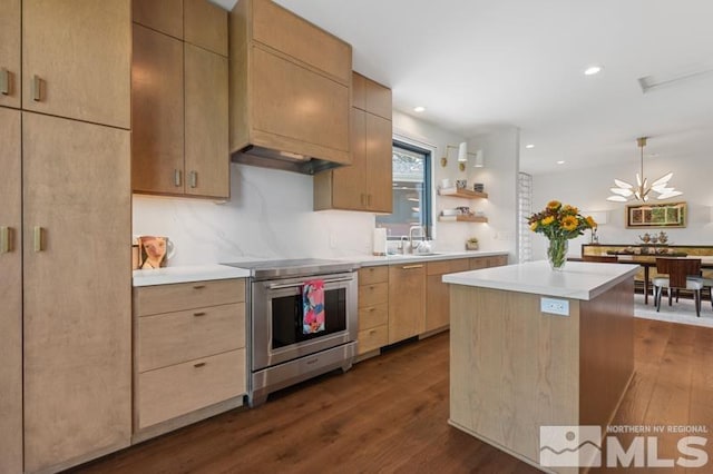 kitchen featuring sink, stainless steel range with electric cooktop, light brown cabinets, dark hardwood / wood-style flooring, and a kitchen island