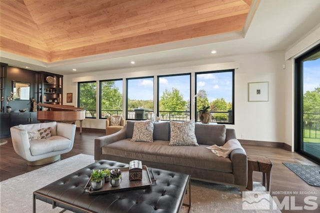 living room with hardwood / wood-style flooring, lofted ceiling, and wooden ceiling