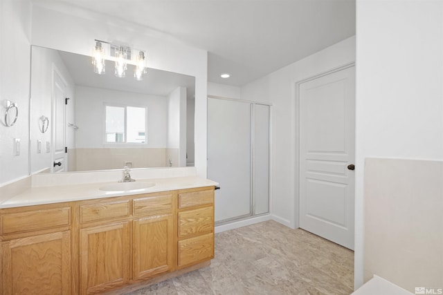 bathroom with vanity and an enclosed shower