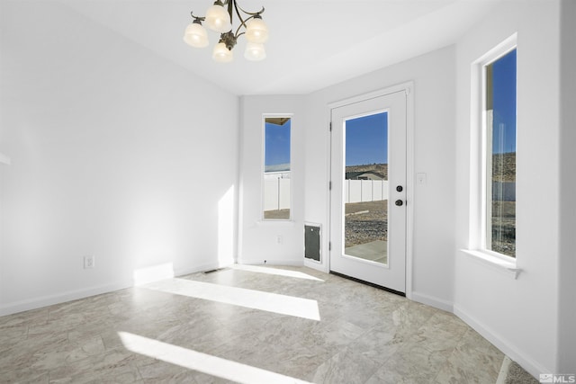 interior space with a notable chandelier