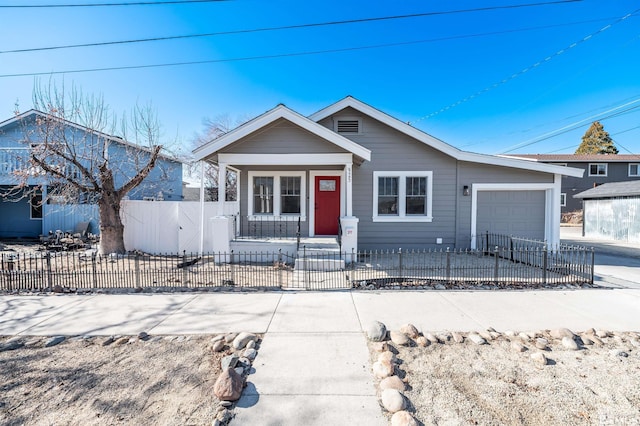 view of front of property featuring a garage and a porch