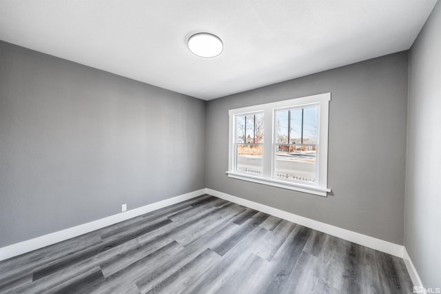 spare room with wood-type flooring