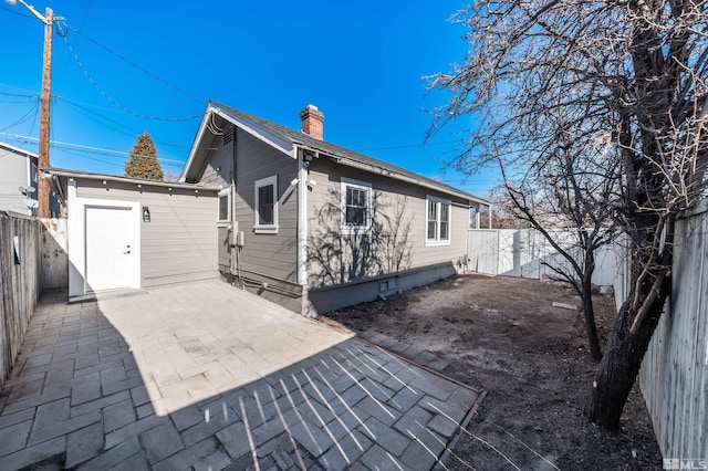 rear view of house featuring a patio