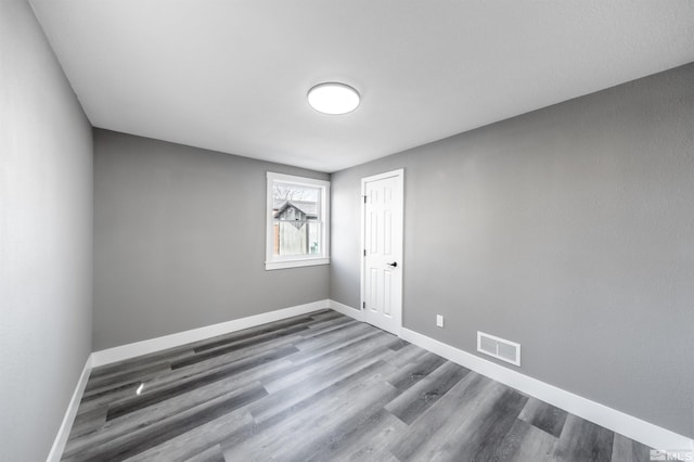 spare room featuring hardwood / wood-style flooring