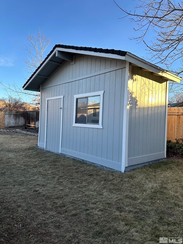 view of outdoor structure with a yard