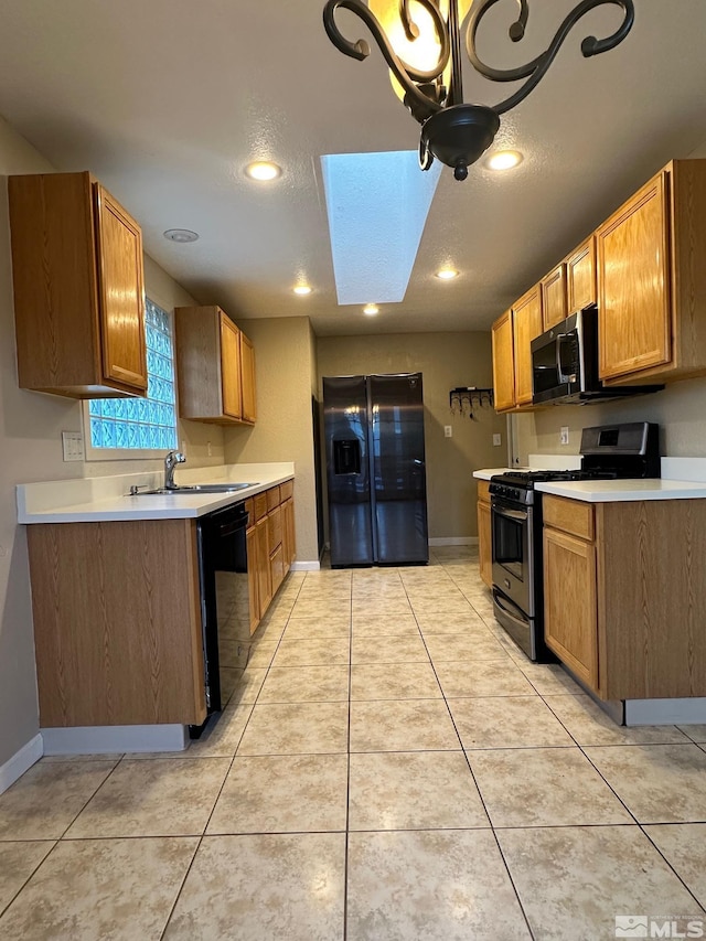 kitchen with refrigerator with ice dispenser, sink, light tile patterned floors, black dishwasher, and gas stove