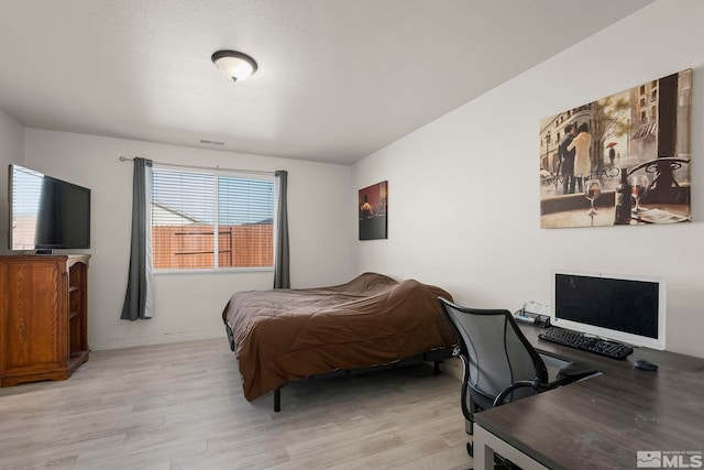 bedroom with light hardwood / wood-style floors